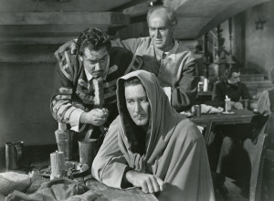 Captain Alvarez (Raymond Burr), the innkeeper (David Leonard) and Don Juan.