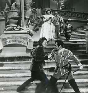 Duke de Lorca (Robert Douglas) battles with Don Juan as the Spanish royalty watch from above.
